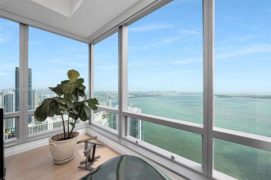 Exquisite and modern home in the sky on the 61st Floor at the exclusive and prestigious Four Seasons Residences on Brickell. Enjoy unparalleled views of Biscayne Bay, Miami Beach, Fisher Island, Key Biscayne, Atlantic Ocean and beyond from this very unique line E corner unit, rarely available. 2738 sq feet. 3 bedrooms in suite and an extra half bathroom. Featuring top of the line finishes including granite counter-tops, wood floor, Miele & Sub Zero appliances and more. Residents have access to all of the Four Seasons amenities and comforts of a 5 star building. Includes two Gym Memberships, one storage (A/C) and 2 assigned covered parking spaces.!!