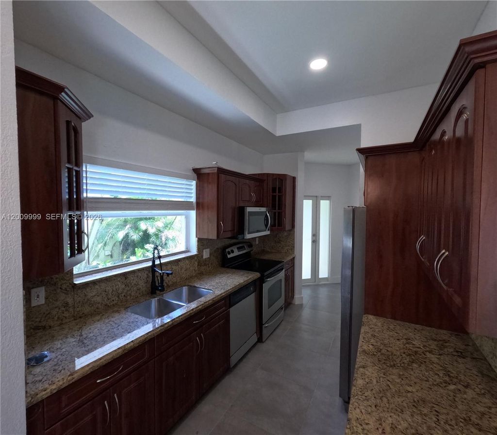 Photo of 1211 SW 84th Ter #1211, Pembroke Pines, FL 33025 (MLS # A12009999)