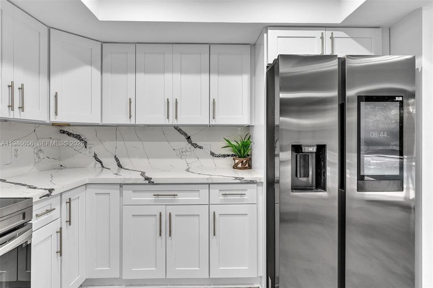 Welcome to The Moors – Fully renovated 2-story dream home in gated community! Located near the Palmetto Expressway, this 4BD/3BA home features a spacious loft, new roof (10-year warranty), impact windows, waterproof laminate flooring, renovated bathrooms, The updated kitchen has quartz counters, wood cabinets, stainless steel appliances, and a pass-through to the living area. One bedroom and full bath are on the first floor; remaining bedrooms and loft upstairs. Oversized master with walk-in closet and luxurious bath with tub and shower. Enjoy 24/7 security, low HOA, and resort-style amenities: clubhouse, gym, guesthouse, and lake great for fishing. Covered patio and pool-sized yard.