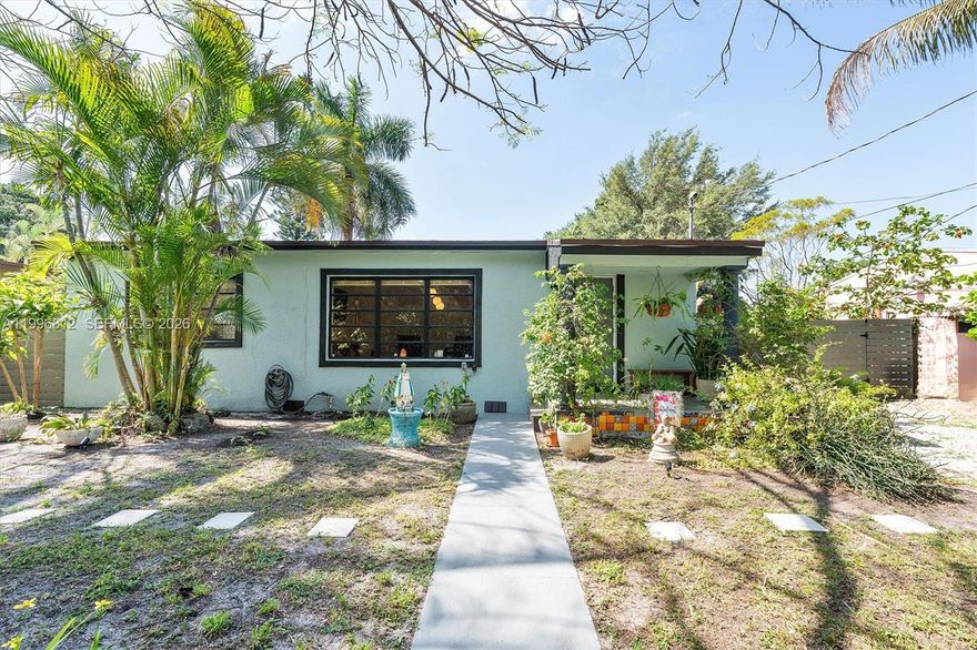 Welcome to this meticulously maintained 1954 Mid-Century Modern gem, where historic character meets extensive contemporary upgrades. Situated on a generous 9,207-square-foot lot, this property offers rare versatility thanks to its Mixed-Use zoning. The main residence features a thoughtful three-bedroom, two-bathroom layout across 975 square feet of first-floor living space, anchored by original bamboo flooring and elegant crown molding throughout. Significant investments ensure peace of mind for years to come. A brand-new GAF asphalt shingle roof was installed in 2025, complete with a transferable 50-year warranty, complemented by fresh R30 attic insulation. The split VAC A/C system was professionally serviced and deep-cleaned in 2025, and the septic tank has been regularly maintained. Recent 2026 monochromatic exterior paint refreshes both the house and the grandfathered-in storage shed, which features solar motion sensor lighting. The freshly painted interior glows with neutral painter's color, recessed soft lighting, modern fixtures, and new ceiling fans. The kitchen boasts a new 2025 refrigerator and an updated double sink with a modern faucet. Practicality continues in the dedicated laundry room, equipped with a utility sink and a 2025 washer. Outdoor living features a 200-sq ft repainted terrace nestled among established Florida native hedges and trees, illuminated by 100 ft of string lights and ambient spotlights. Located near diverse parks, transit, and local dining.