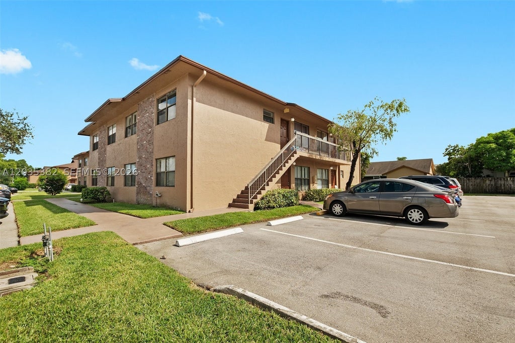 Photo of 10053 Winding Lake Rd #101, Sunrise, FL 33351 (MLS # A12035382)