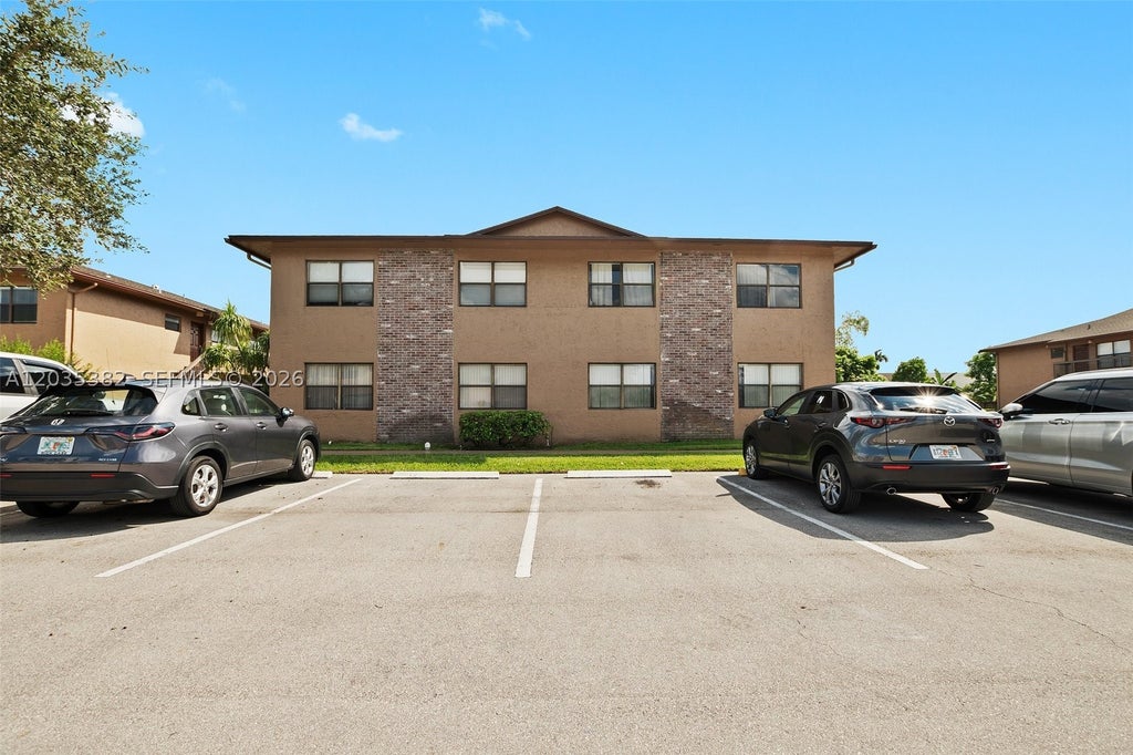 Photo of 10053 Winding Lake Rd #101, Sunrise, FL 33351 (MLS # A12035382)