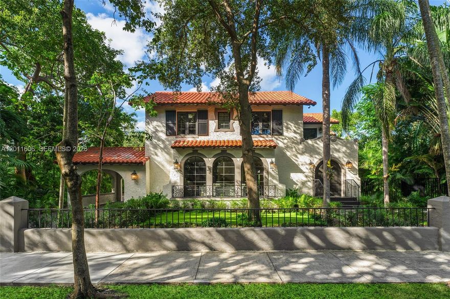 Stunning 5 BR/5.5 BA residence with brand-new designer gut renovation in guard-gated Morningside. Offering 4,931 total SF on a 10,260 SF lushly landscaped lot. This home blends timeless elegance with modern luxury. Enter to a light-filled foyer and formal living room along with a fireplace and arched windows, flowing to a formal dining room. The chef’s kitchen with Taj Mahal stone counter tops, large eat-in island and top-of-line Viking appliances. Open family room features dramatic arched doors opening to a backyard with a saltwater pool. Upstairs boasts hardwood floors, expansive primary suite with a spa-like rain shower and 3 additional en-suite BRs. Includes a private guest house studio above a 2-car air-conditioned garage, plus a covered carport. Smart home with new impact windows/doors, electrical & plumbing. Minutes to top schools and the Miami Design District.