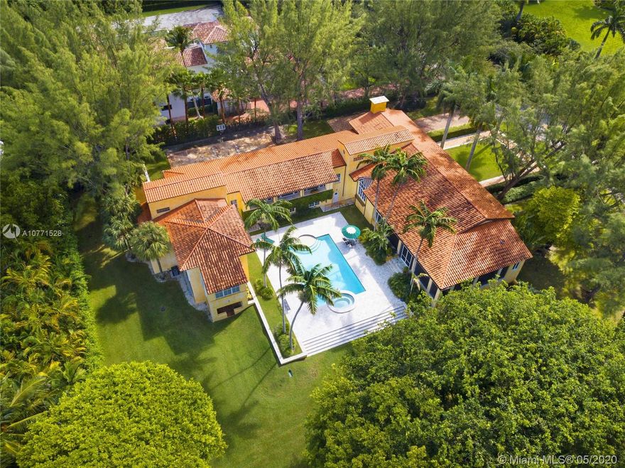 This masterfully designed 5 bedroom, 4.5 bath home (7,950 adj sf, $670/sf), on 1.1 acres, offers a fantastic opportunity to reside in Miami’s top gated community, Gables Estates. It features timeless crafted finishes, a wonderful floor plan, soaring ceilings and beautiful natural light throughout. Spacious interior living spaces, along with a large screened-in keystone patio with barbeque, oversized heated pool/jacuzzi and expansive yard create an atmosphere of warm and gracious living, along with plenty of room for kids to play and for year-round entertaining in intimate or large groups. There are custom built-ins throughout, a gourmet cook’s kitchen, exercise and playrooms, loads of storage, whole house generator, and more. Virtual photos show a variety of possible decorating styles.