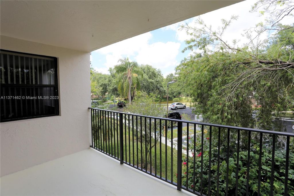 Photo of 10115 W Sunrise Blvd #203, Plantation, FL 33322 (MLS # A11371462)