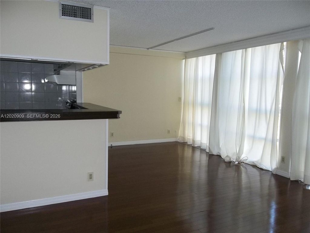 Photo of 801 Three Islands Blvd #308, Hallandale Beach, FL 33009 (MLS # A12020909)