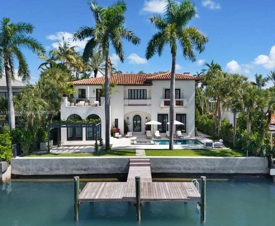 Timeless Architecture Reimagined with Modern Elegance on Iconic N Bay Rd. Developed by Menin Homes & architecture by Zeb Jarosz, this waterfront estate showcases wide open bay & skyline views. Main house offers 4BD/4.5BA while a detached guest residence includes 3BD/3BA with garage. 12’ ceilings, Marmorino plaster walls & wood flooring throughout frames light-filled interiors anchored by a bamboo-flamed travertine fireplace. Bespoke ITALKRAFT kitchen with Sub-Zero & Wolf appliances complements marble-accented baths & custom millwork. Primary suite boasts a steam room, sauna, his & her toilets & terrace with a cold plunge. Enjoy a new pool, jacuzzi, Cocoon shower & custom BBQ. Fully automated Control4 smart home w/ generator, Apparatus lighting & ATRA furnishings complete this masterpiece.