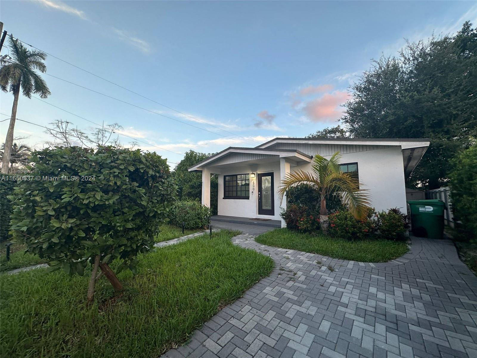 Stunning 3-bedroom, 2-bathroom home just 3 minutes from I-95, offering easy access to Downtown Miami, Brickell, and Wynwood. This beautifully lit home is designed for modern living, featuring impact windows that ensure a peaceful environment, a sleek open-concept kitchen with stainless steel appliances and a large island, and spacious rooms with renovated bathrooms. With two automatic gate garages and ample parking, it's perfect for families seeking both comfort and convenience.