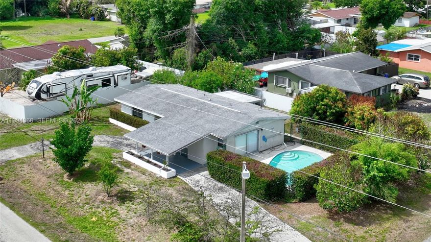 Desirable Willow Lakes community! This single family home has 2 bedrooms, 2 bathrooms, and a spacious family room that could easily be converted into a 3rd bedroom. Soak in the sun in your very own in-ground pool and separate screened lanai. Situated on a corner lot, this home offers of plenty of outdoor space for your BBQ and friends time. Inside is an utility room. It comes with central utility services and an attached drive through carport. Don't miss out on this incredible opportunity to own this affordable priced home. Roof/2018 & Air Cond/2023.