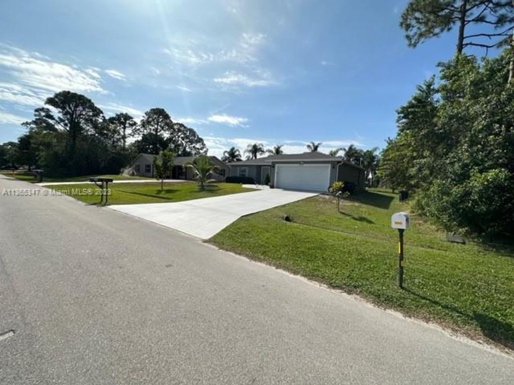 Photo of 1250 SW Albenga Ave, Port Saint Lucie, FL 34953 (MLS # A11365347)