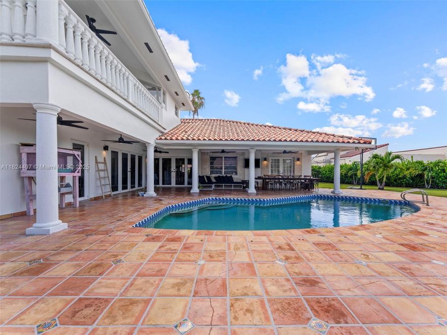 Beautiful executive home in the heart of Tamiami, just 7 min to FIU, 2 min to Belen Jesuit, and 5 min from the Miami-Dade County Fairgrounds. This spacious 6-bed, 4.5-bath residence features a brand-new kitchen, separated family room, and two suites—one junior primary downstairs and a luxurious upstairs primary with a private office. Situated on an oversized 23,000+ sq ft lot, the backyard is a true oasis with a pergola, 24x24 ft tiki hut, and full outdoor cooking area—perfect for entertaining or relaxing with family. A rare gem in a prime location!