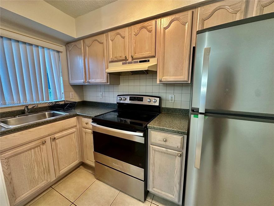 Discover this charming and spacious one-bedroom, one-bathroom apartment, situated as a corner unit on the first floor with it's private patio area. The building offers ample parking, includes water, and features central A/C unit. Residents can enjoy the convenience of an on-site common laundry facility and a pool, all with the advantage of no HOA. Experience swift approval processes. Seize this opportunity now!