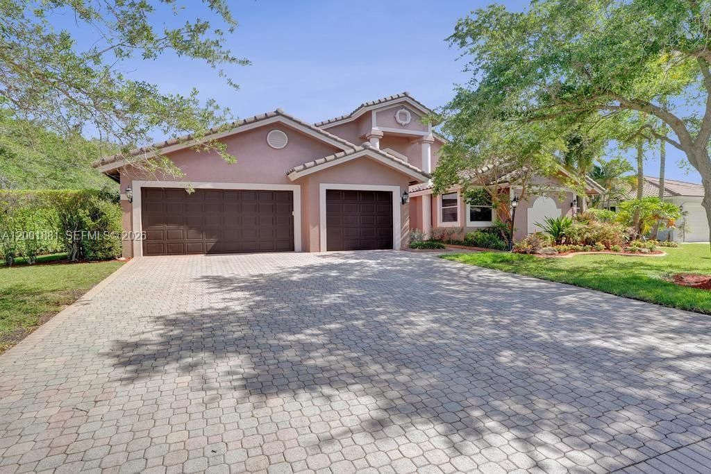 Photo of 9921 NW 60th Pl, Parkland, FL 33076 (MLS # A12001881)