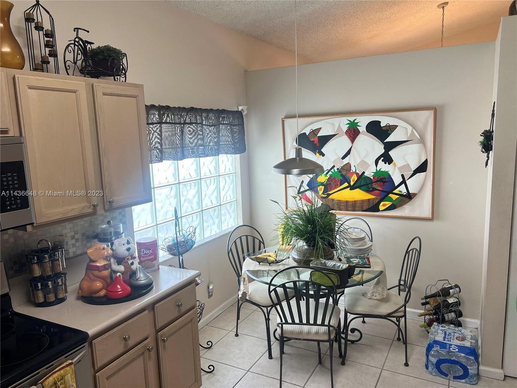 Photo of 4024 NW 62nd Dr, Coconut Creek, FL 33073 (MLS # A11436648)