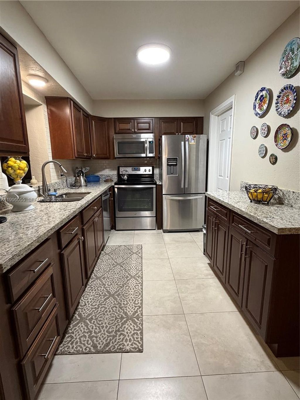 Photo of 7008 NW 95th Ter, Tamarac, FL 33321 (MLS # A11996055)