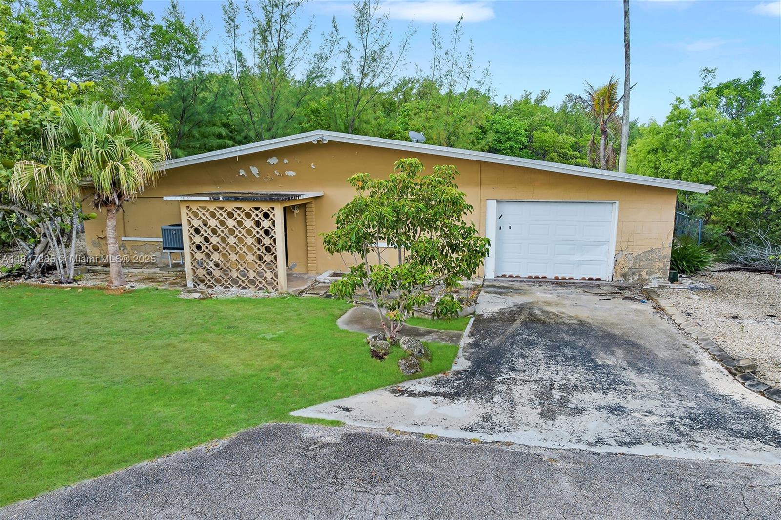 Opportunity knocks in the heart of Key Largo! This property sits on a 7,500 sq/ft lot just minutes from waterfront dining, shopping, marinas, and Publix. Enjoy nearby parks like John Pennekamp Coral Reef State Park and quick access to U.S.-1 for easy travel throughout the Keys. The home is in need of repair but offers a prime chance to renovate or rebuild in one of the most desirable locations in the Upper Keys. Whether you're looking for a weekend retreat, future home, or income-producing potential, this location delivers unmatched convenience and lifestyle access. PROPERTY IS IN FIRST LOOK PERIOD. ONLY OWNER OCCUPANT OFFERS WILL BE CONSIDERED UNTIL 8/25/25