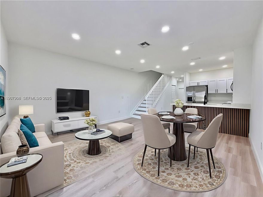 Spacious 3-bedroom/3-bathroom townhome featuring an open layout with many features. Nestled in the heart of Tamarac, this town home offers a full bedroom and bathroom on the first floor for added convenience. The kitchen includes stainless steel appliances and Quartz counter tops for seating. Other notable features include: Pergo waterproof flooring, master dual vanities & walk-in closets. Enjoy peaceful living with golf course views, no rear neighbors, and an expanded patio area. Townhome has a storage room in the back. 2 assigned parking spaces are conveniently located right in front. Low association of $190 per month and pet friendly. Leasing permitted in the FIRST YEAR of ownership.  Just minutes from major highways & Sawgrass Mills —A must see!