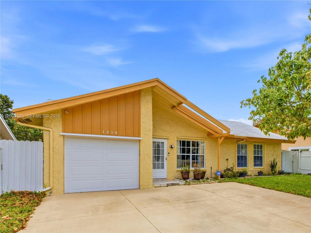 Photo of 1319 SW 74th Ave, North Lauderdale, FL 33068 (MLS # A12001246)