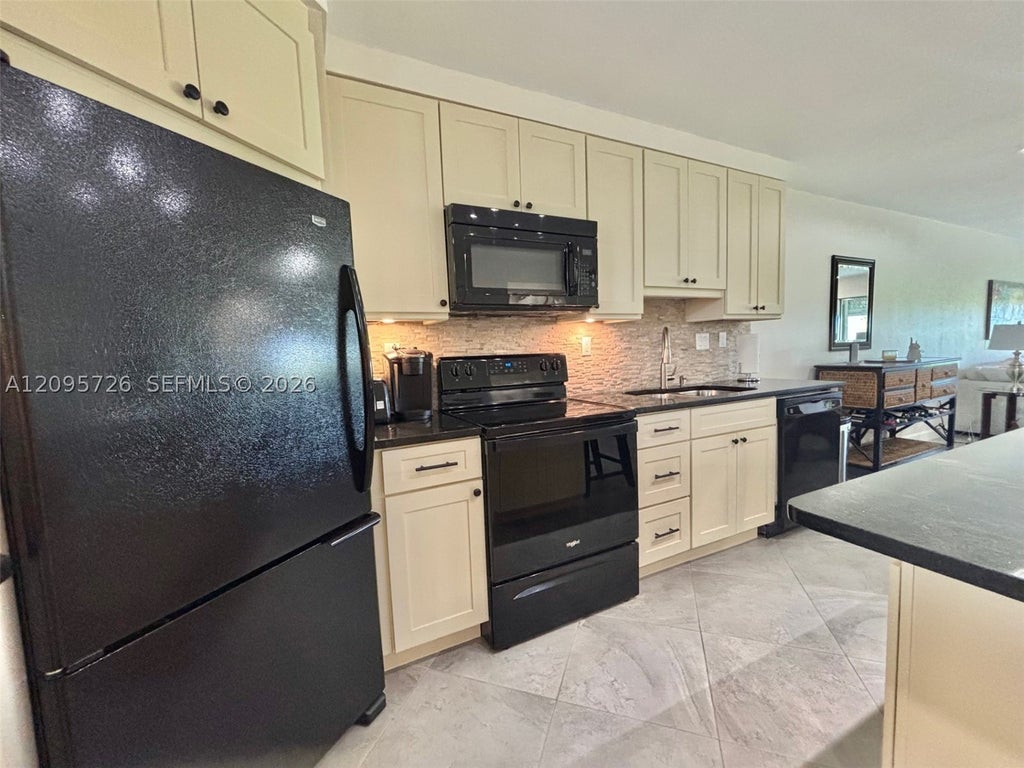 Photo of 3920 Inverrary Blvd #607C, Lauderhill, FL 33319 (MLS # A12095726)