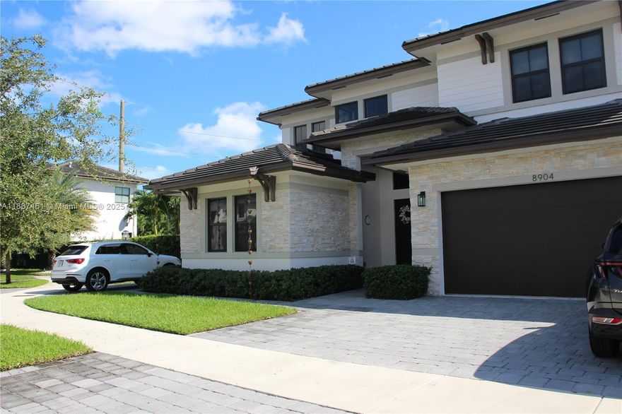 Welcome to Luxurious Eight Home Enclave, Harmony Cove, built in 2020. This stunning single family residence boasts 5 bedrooms, 6 baths, (one en-suite bedroom located on the first floor), 2 car garage, high ceilings, impact windows and doors, chef's kitchen, Subzero/Wolf stainless steel appliances, spacious island and Calacatta Quartz waterfall counter tops. The spacious bedrooms offer peaceful retreats, each with sleek modern baths. Lavish primary suite offers spa-style bath, oversized shower, soaking tub and dual master closets. Entertain effortlessly under the covered terrace with stainless steel BBQ, over sized salt water heated pool, jacuzzi, marble deck and cabana bath. NO HOA. Complete with outdoor lighting, irrigation system & generator, no detail is spared. PRICED TO SELL.