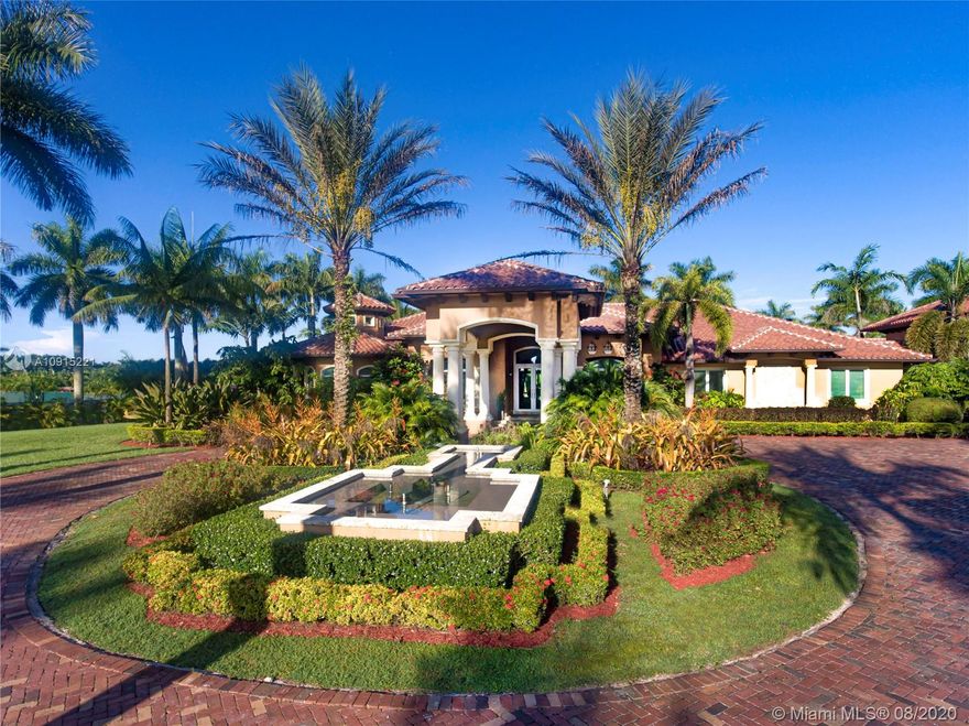 Sprawling 5-Acre Estate in the Redlands. Amazing home w/ plenty of room to relax. 4-bed, 3.5 bath split plan in the main house. Huge Master suite w/ walk-in closets, double vanities & shower. High ceilings, open plan Chef's kitchen, formal dining room, wine cellar, wet bar, movie theater - all completed in wood finishes and marble floors. Impact windows & doors throughout. Full home stand-by generator. Attached apartment/guest quarters w/ full kitchen, dining & family room. Amazing tropical patio w/ pebble tech pool & hot tub. 3-car garage w/ another 1-bed, 1-bath, kitchen/dining room apartment. 2.5 acres of property planted w/ variety of large income palm trees - classifies property's tax folio. Home sits on 12' elevations. An elegant & stately place to enjoy a great quality of life.