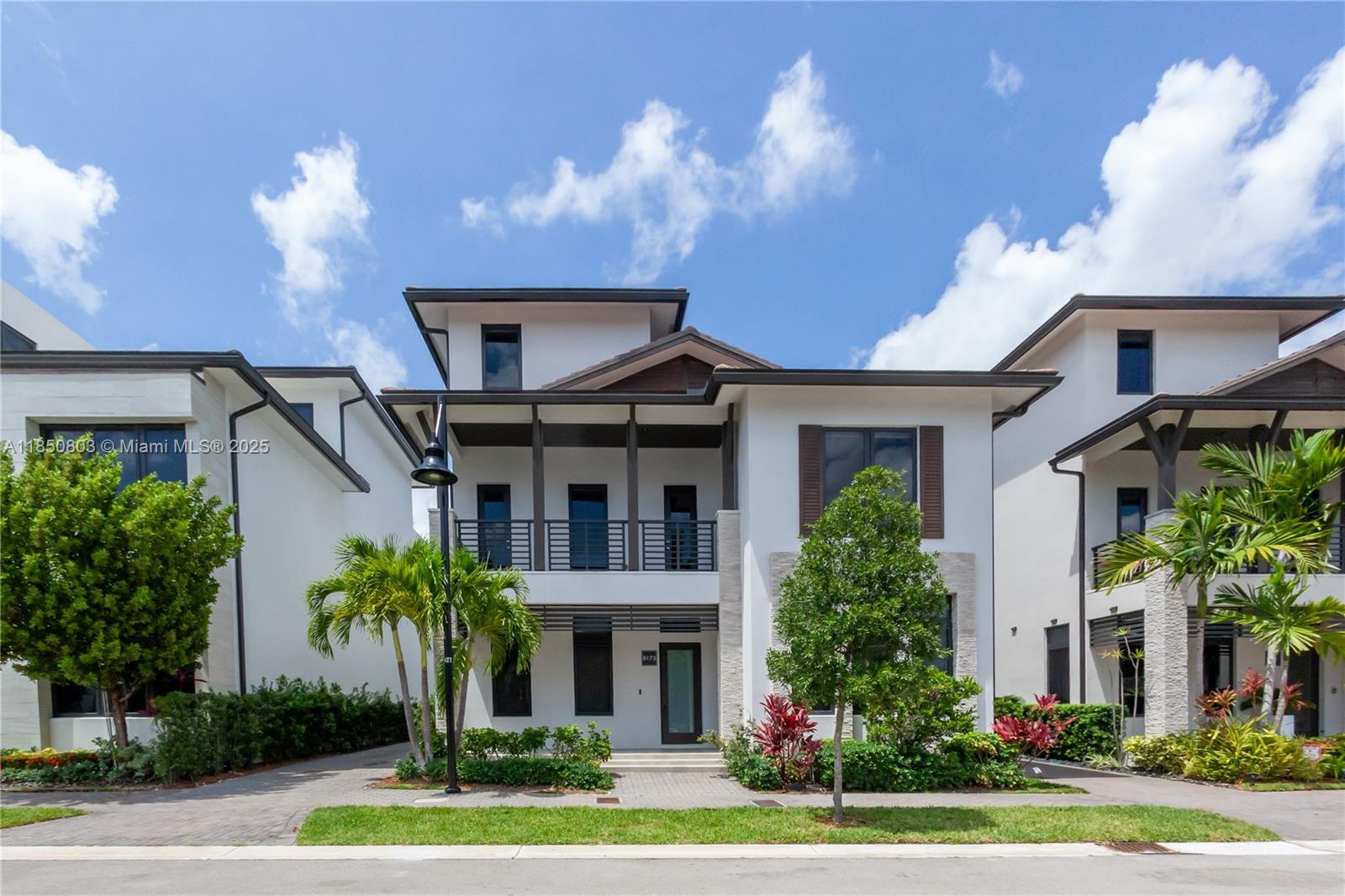 Designed for both comfort and luxury, the home features hurricane-proof windows and doors, elegant marble floors, an airy layout with soaring ceilings and a sleek open stairwell accented by plexiglass handrails. Natural light floods every room, enhancing the modern finishes throughout.
The chef’s kitchen features an upgraded marble island, top-of-the-line appliances (including premium oven, stove, microwave), and a built-in wine fridge. The home includes three walk-in closets. A massive walk-in closet in the master suite, offering luxurious storage and dressing space. Each bedroom includes its own private en-suite bathroom, and the home is complete with multiple balconies, elevated outdoor patios, a long driveway, and a brand-new custom pool.