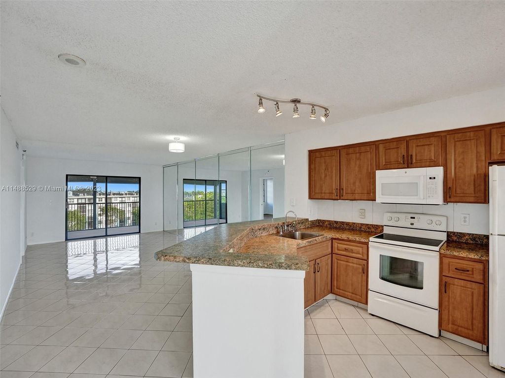 Photo of 2215 Cypress Island Dr #603, Pompano Beach, FL 33069 (MLS # A11488529)