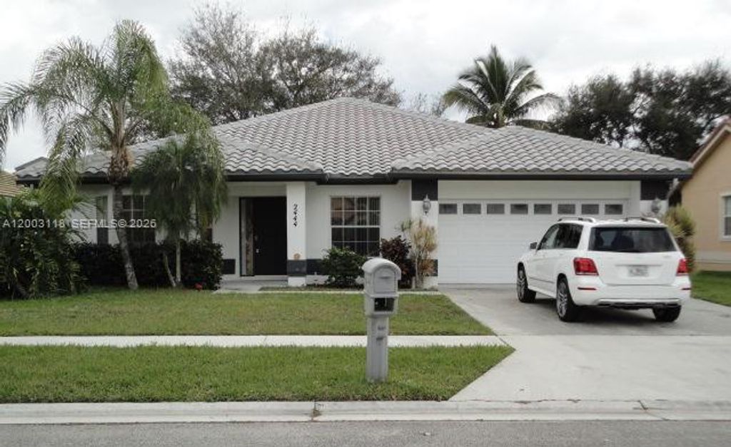 Photo of 2444 Stonegate Dr, Wellington, FL 33414 (MLS # A12003118)
