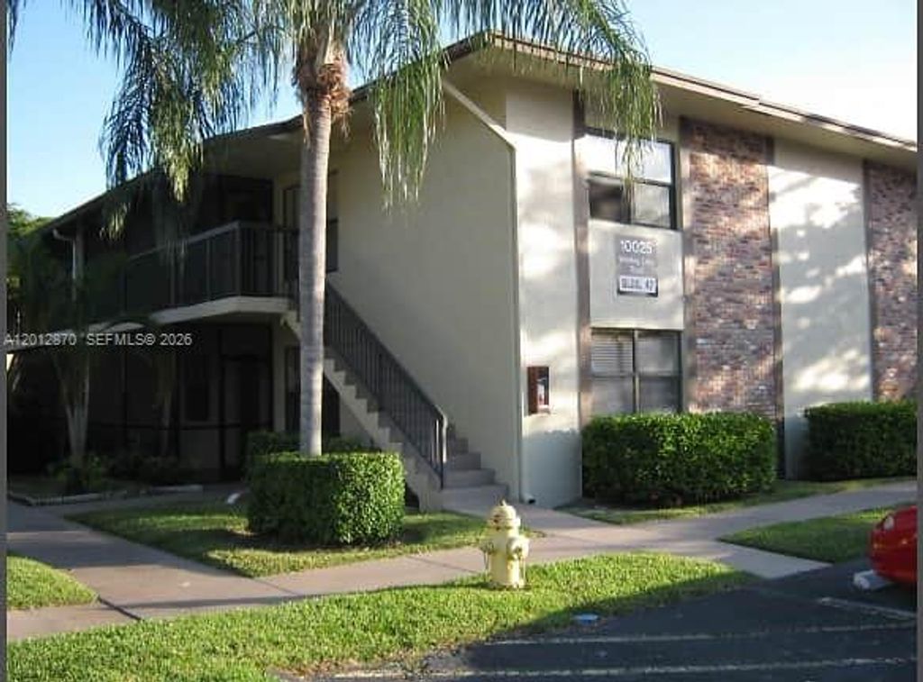 Photo of 10025 Winding Lake Rd #202, Sunrise, FL 33351 (MLS # A12012870)