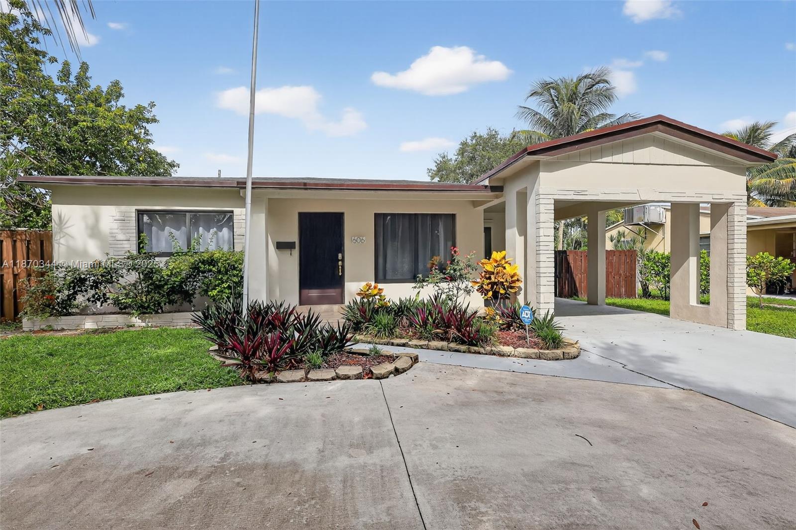 Beautifully renovated 2-bedroom, 2-bathroom home with carport in the heart of Hollywood. Enjoy impact glass windows, a stunning kitchen with white cabinetry, quartz countertops, and stainless steel appliances. Bathrooms are tastefully remodeled. Home features new laminate flooring, indoor laundry room, and an open living space. The large yard is perfect for outdoor enjoyment. No HOA! Conveniently located just minutes from I-95. Security alarm, lawn maintenance, and Terminix pest control are included in rent. Available for immediate occupancy! Non refundable pet deposit. Max 2 pets dog/cat. Max pet weight, 60 pounds.