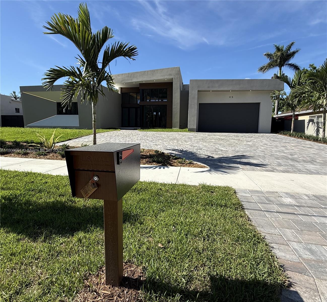 NEW CONSTRUCTION!!! 4,214 sqft 4 bed 5 bath one story CONCRETE ROOF Single Family Home with 2 car garage with EV ready and impact windows and doors on a 12,740 sq ft lot with pool and NO HOA. Lot large enough to park boats and/or RV. Beautiful driveway with lush landscaping and lighting. The home has +/-16ft ceilings in the great room and up to +/-13ft ceiling in the master with 3 walk in closets and huge master bath. Master bath has tub with walk around showers. This home features a beautiful modern/contemporary design with recessed lighting throughout the home and linear AC diffusers. Extra-large kitchen island with counter depth large refrigerator, walk in wine cellar and BBQ with outdoor kitchen and ceiling fans in terrace. Home comes with Sonance in ceiling speakers and smart ready.