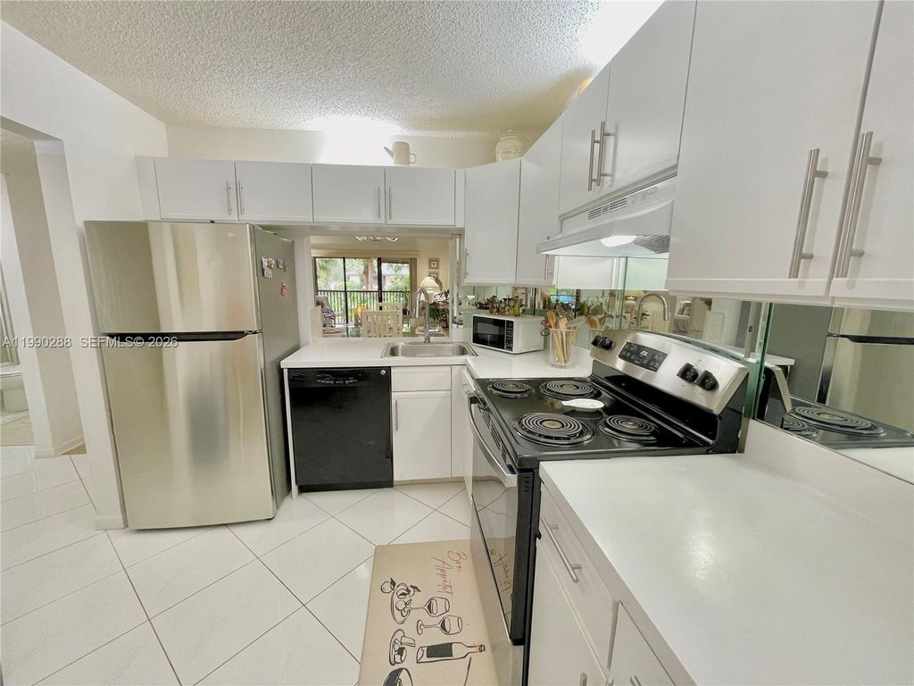 Photo of 3137 S Carambola Cir #2369, Coconut Creek, FL 33066 (MLS # A11990288)