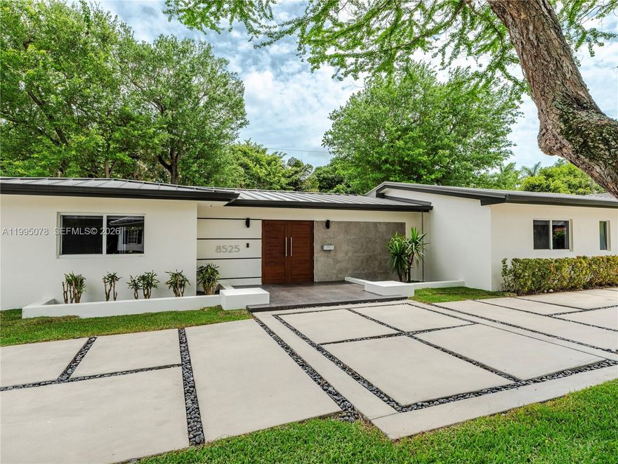 Completely rebuilt in 2017 (construction permits available), this exceptional residence provides 3374 SF of indoor & covered outdoor areas. Every major system and finish has been thoughtfully upgraded, creating a turnkey home designed for both comfort and style. The renovation included electrical systems (buried utility lines), updated plumbing (removed cast iron pipes). Interior and exterior improvements include reconfigured hurricane resistant windows and doors, framing & drywall, interior doors, bathrooms, flooring. The kitchen and baths showcase modern cabinetry, countertops, and appliances. A metal roof with gutters throughout, while mechanical systems were upgraded to include two-zone air conditioning, ducts, and tankless water heaters for optimal efficiency and comfort.

Designed with outdoor living in mind, the property features a resort-style heated and cooled pool, along with a custom pergola complete with ceiling fans and a built-in sound system—perfect for entertaining year-round. The lush landscaping includes a fully irrigated yard with three sprinkler zones, a dedicated children’s play area, and a mature podocarpus hedge providing privacy and greenery. Five mature trees, including three stately oaks, further enhance the property’s natural beauty and shade. This is a rare opportunity to own a home, on a 15,600 SF lot, that offers the character of a classic build with the systems, finishes, and lifestyle of a much newer residence.