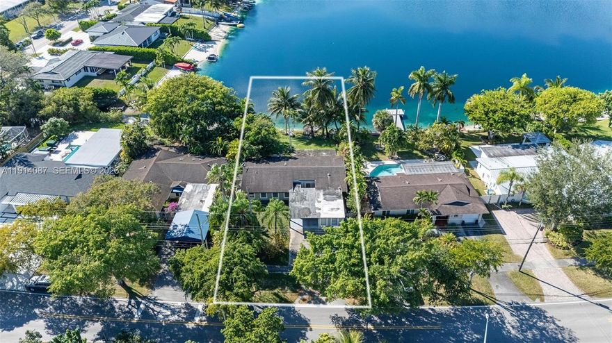 This is a rare opportunity to build a brand-new home on the highly coveted blue lake, one of Miami’s most
desirable and exclusive motorized lakes. Situated on a generous 10,490 sq ft lot, the property offers expansive
lake frontage with some of the most breathtaking sunset views anywhere in the city. The sparkling blue water
creates a tranquil backdrop & provides direct access to boating, jet skiing, fishing, paddleboarding, and more—
right from your own backyard. Whether you envision a modern estate or a serene waterfront retreat, this property offers endless possibilities to create your dream home while enjoying unmatched natural beauty and year-round outdoor living. Shown by appointment only, develop the existing home or build your dream in paradise!