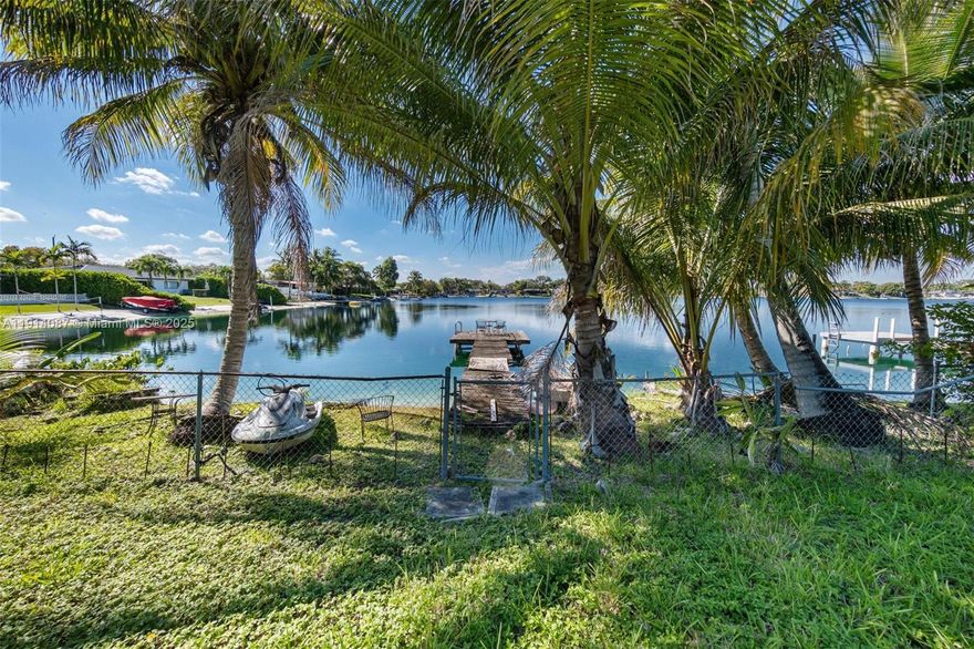 This is a rare opportunity to build a brand-new home on the highly coveted blue lake, one of Miami’s most
desirable and exclusive motorized lakes. Situated on a generous 10,490 sq ft lot, the property offers expansive
lake frontage with some of the most breathtaking sunset views anywhere in the city. The sparkling blue water
creates a tranquil backdrop & provides direct access to boating, jet skiing, fishing, paddleboarding, and more—
right from your own backyard. Whether you envision a modern estate or a serene waterfront retreat, this property offers endless possibilities to create your dream home while enjoying unmatched natural beauty and year-round outdoor living. Shown by appointment only, develop the existing home or build your dream in paradise!