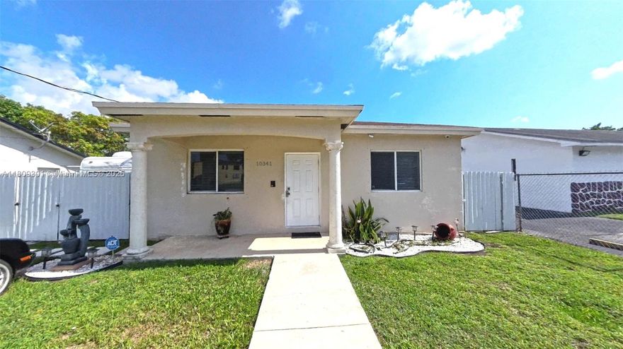 This beautiful and well-maintained 3-bedroom, 2-bathroom home is move-in ready. It features a large driveway, a spacious living room with a beautiful wall-mounted fireplace, a kitchen with modern appliances, and a fully fenced yard with enough space for a boat or RV. Step out onto your private deck in the backyard. The deck offers an ideal space for al fresco dining or relaxing in the shade, with a fully equipped outdoor kitchen and ample built-in storage for all your belongings. New air conditioning and accordion shutters for storm protection. Don't miss this incredible opportunity! Schedule your showing today!