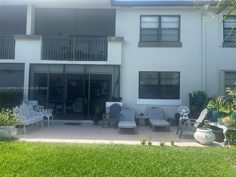 Photo of 9656 W Mcnab Rd #105, Tamarac, FL 33321 (MLS # A11688708)