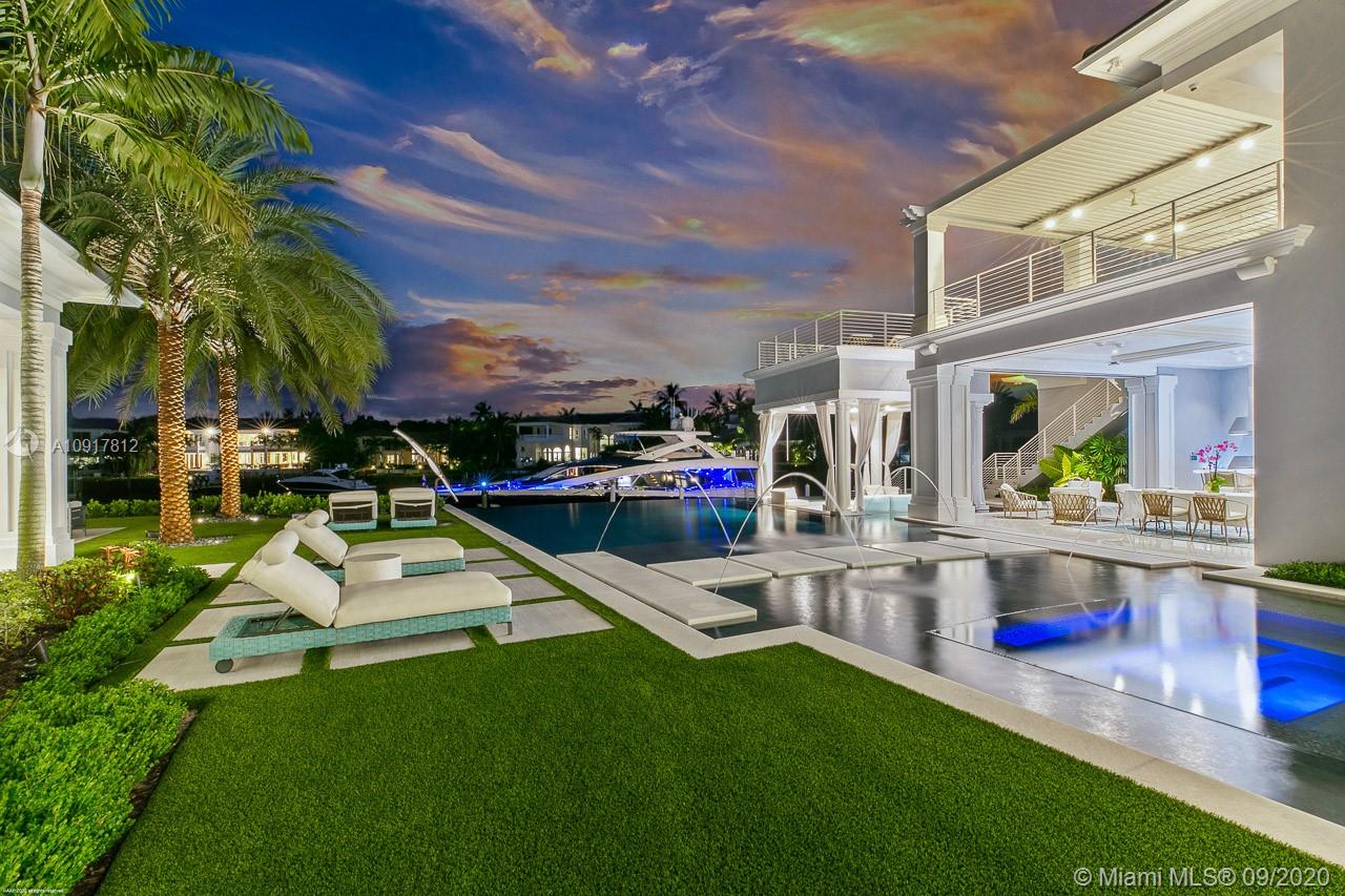 There's this and then there's everything else. If you are satisfied with only the best this show-stopping, custom built, waterfront estate home is for you! Located in the prestigious golf & boating community of Admirals Cove, 377 exemplifies quality, craftsmanship, technology and design at its best. Situated on over 220' of water frontage with views that can't be matched. This home boasts unrivaled hand-picked, modern features and top-of-the-line everything including an unrivaled Officine Gullo custom kitchen imported from Florence (only the 3rd installation of its kind in the US), custom designed Downsview cabinetry throughout the home, 2nd floor golf simulator designed and installed by Trackman, and a real commercial IMAX Dolby Atmos theater with a jaw dropping 25 foot screen!
