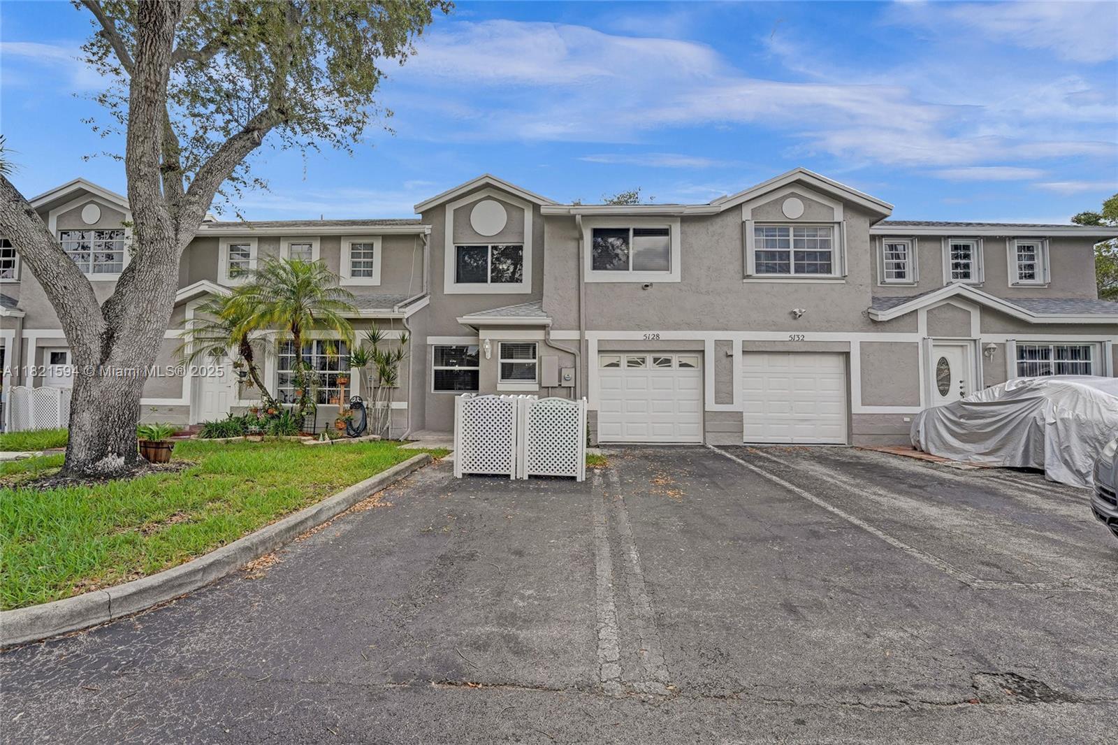 Move-in ready home in Cooper City with full impact protection: windows, front door, French doors, garage door, and garage entry. Freshly painted inside and out. Enjoy a brand-new kitchen with granite countertops and stainless steel appliances. Bathrooms have new vanities. Roof 2021 with new fascia and gutters. New AC, water heater, attic insulation, window sills, and electrical outlets. Canal-front patio adds serene outdoor space. Community offers pool, basketball, and tennis courts. Low HOA $185/mo. No rental restrictions. Pets welcome!