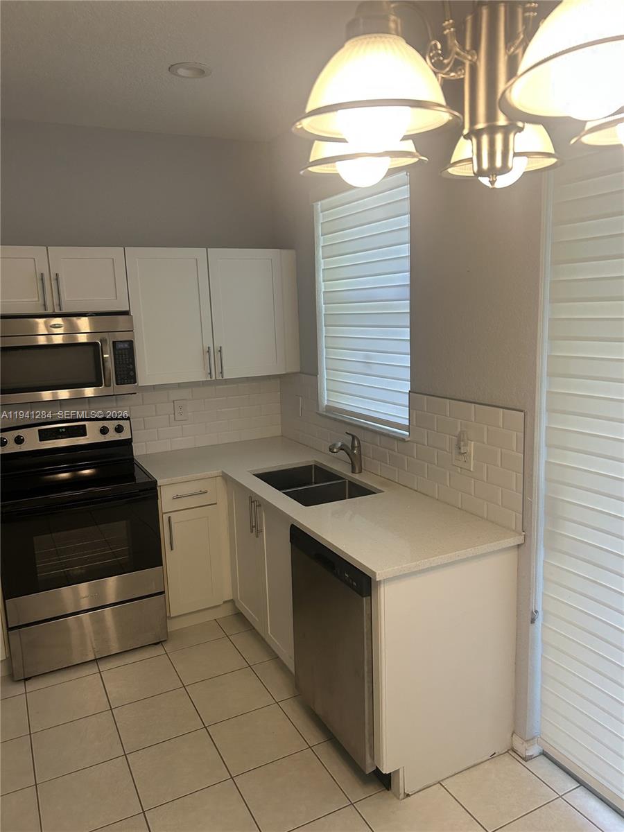 Photo of 11707 NW 47th Dr, Coral Springs, FL 33076 (MLS # A11941284)