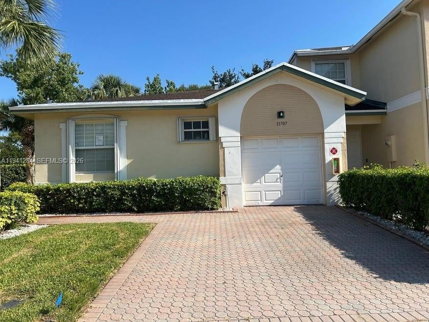 Photo of 11707 NW 47th Dr, Coral Springs, FL 33076 (MLS # A11941284)