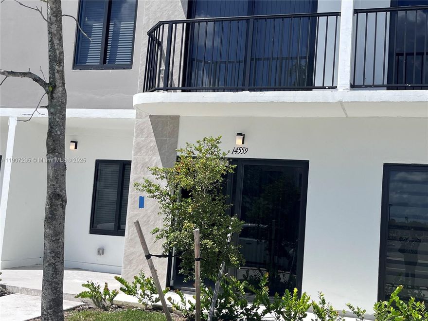 4BR/3Bath townhome  features, Concrete home with impact windows, rooftop terrace and 2 parking spaces. Beautiful interiors with quartz counter tops, modern style open kitchen with stainless steel appliances. Master bedroom has a full bathroom, walk in closet and balcony. Unique flex-room on the ground floor includes a closet and full bathroom, could be used as a bedroom/office or in-laws. Easy showings, and fast approvals. This property also offers deposit-free leasing using Obligo (for qualified tenants). Available with No Security Deposit with Obligo! located at intersection of 147th Ave and 260th St. Google map search "Onx Homes on Grandville"