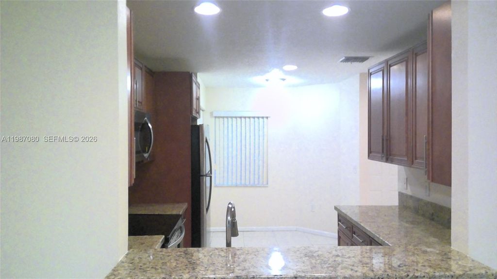 Photo of 9960 NW 19th Pl, Sunrise, FL 33322 (MLS # A11987080)