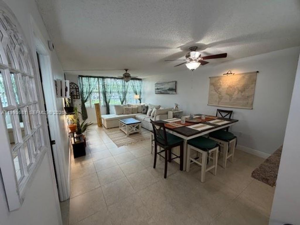 Photo of 1100 Saint Charles Pl #L6, Pembroke Pines, FL 33026 (MLS # A11993681)