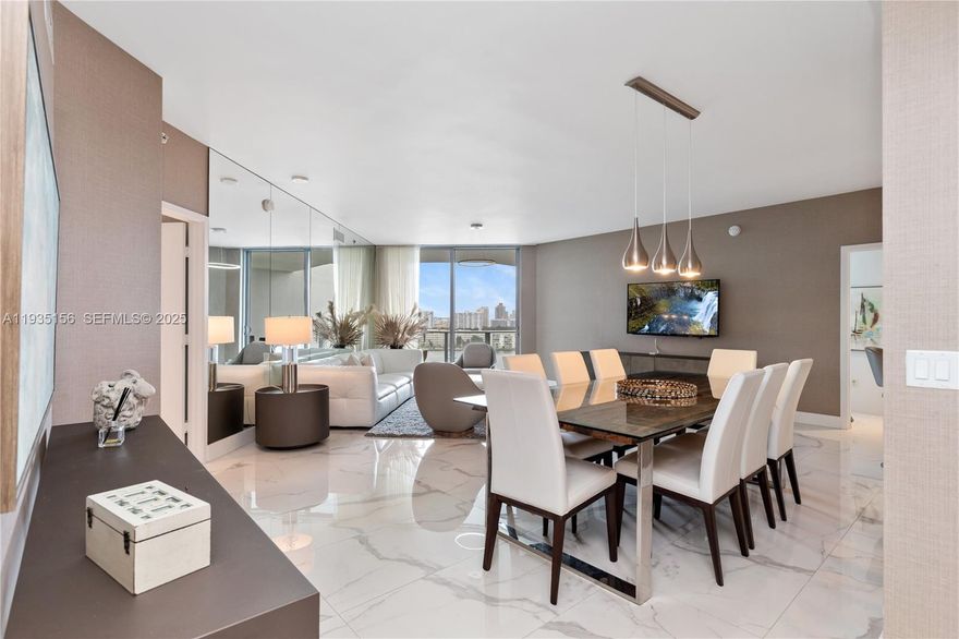 Introducing a stunning waterfront furnished unit featuring 2 spacious bedrooms and a generous Den converted into a third bedroom, along with 3 full baths. This thoughtfully designed floor plan, maximizes space and efficiency! The unit boasts tasteful decor by a professional interior designer, with meticulous attention to details, including elegant wallpaper throughout and marble style look tile flooring. Enjoy the expansive balcony, offering breathtaking views of the Bay. 
The condo provides marina access for boats up to 100 feet with direct access to the ocean. A relaxing  pool deck with a BBQ area overlooking the bay. It also provides a gated community with 24 hrs security, business center with a cafeteria, party room, concierge services, and a state-of-the-art gym equipped with technogym equipment. Its conveniently located near Costco, fine dining restaurants, Aventura Mall, Bal Harbour shops, nearby public parks offering a variety of recreational options, including pickleball, tennis, basketball courts, soccer field, mountain biking and golf course and much more.