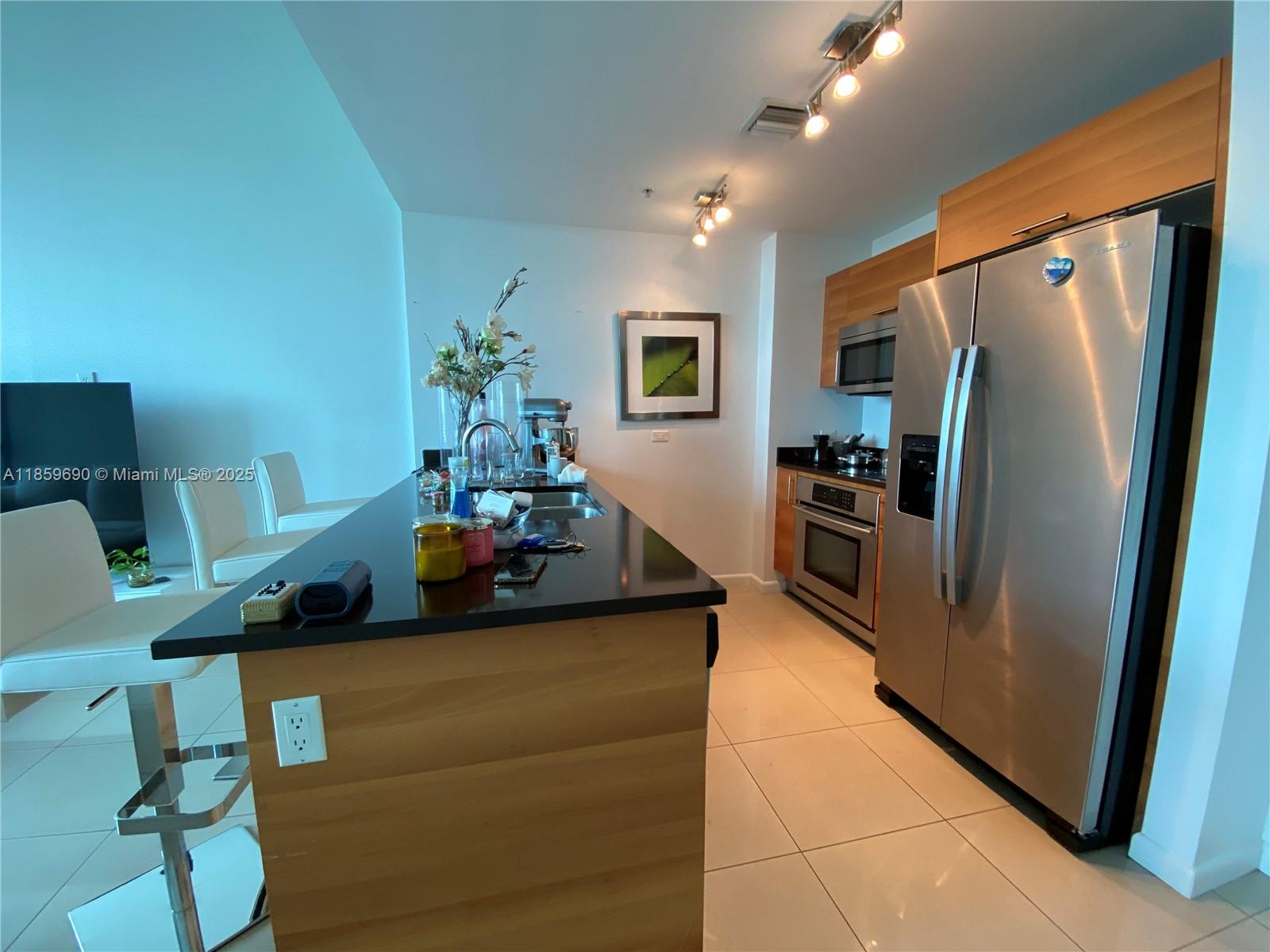BEAUTIFUL AND SPACIOUS 1 BED / 1.5 BATH CONDO AT 4 MIDTOWN MIAMI ON A GREAT LINE. BUILDING AMENITIES ARE ON THE SAME FLOOR WHICH IS VERY CONVENIENT. THIS CONDO FEATURES TILE FLOORING AND FLOOR-TO-CEILING WINDOWS, WALK-IN CLOSETS, MODERN KITCHEN WITH STAINLESS STEEL APPLIANCES AND GRANITE COUNTER TOPS, GLASS SHOWER, BALCONY FACING MIDTOWN, IMPACT WINDOWS. FOUR MIDTOWN FEATURES STATE-OF-THE-ART AMENITIES, POOL WITH JACUZZI, GYM, SAUNA , STEAM ROOM, BBQ AREA, YOGA ROOM, AND BUSINESS CENTER. MIDTOWN IS HIGHLY DESIRABLE POINT IN MIAMI MINUTES FROM THE DESIGN & WYNWOOD ART DISTRICT, EDGE WATER, DOWNTOWN MIAMI, BRICKELL, MIAMI BEACH, AA ARENA AND MIA AIRPORT.