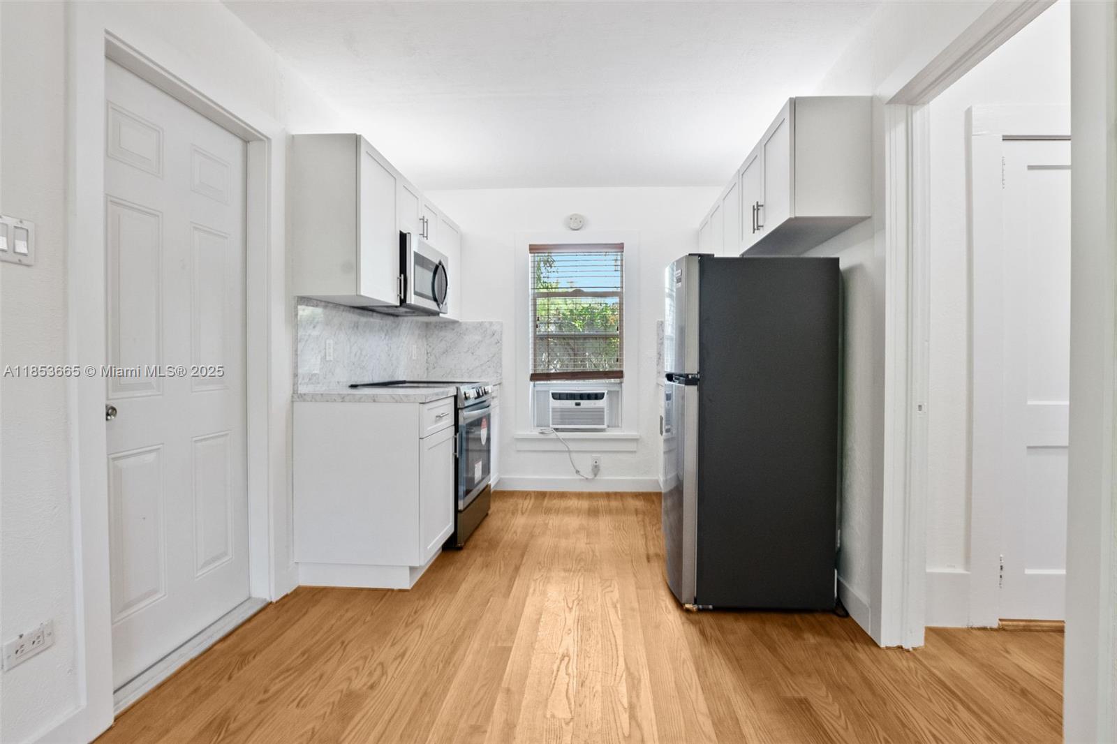 Spacious Shenandoah cottage with private entrance and one parking space. Features a large living room, separate bedroom, and an oversized eat-in kitchen with brand-new stainless steel appliances. Original refinished wood floors and abundant storage add charm and function. Situated just one block from Coral Way, offering quick access to Coconut Grove, Coral Gables, and Brickell & MIA.