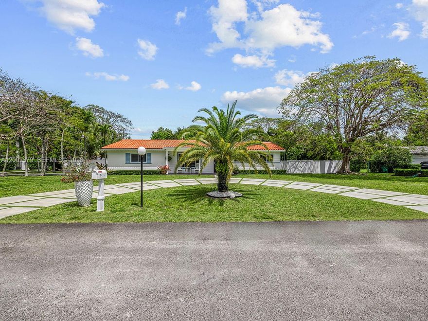 Fully renovated single-family home on a 20,468 SF lot in Glenvar Heights, ideally located just one block from the Palmetto Expressway with immediate access, and minutes from US-1, Dadeland Mall, South Miami, and Baptist Hospital. Situated on a private cul-de-sac with only four residences, this 5-bedroom, 3-bathroom home was redesigned in 2021 and blends modern design with indoor-outdoor living.

The open layout is filled with natural light and enhanced by clean lines, custom millwork, and high-end finishes. The kitchen features sleek cabinetry, a statement island, and premium LG appliances. The kitchen and primary closet were custom-designed by Chris Dalto.

Living areas flow to a resort-style backyard with a 2022 heated saltwater pool and spa/jacuzzi, covered terrace, and custom tiki hut with outdoor kitchen, surrounded by lush landscaping and a full-home water filtration system by Advanced Water Products and a new water pump.

Framed by a white privacy fence and mature palm trees, including a striking front palm, the property offers privacy and curb appeal. Additional highlights include a two-car garage, circular driveway, side garage access, and dual gated entrances.

A rare opportunity to own a fully renovated home with resort-style outdoor living, privacy, and a prime cul-de-sac setting in one of Miami’s most desirable areas.