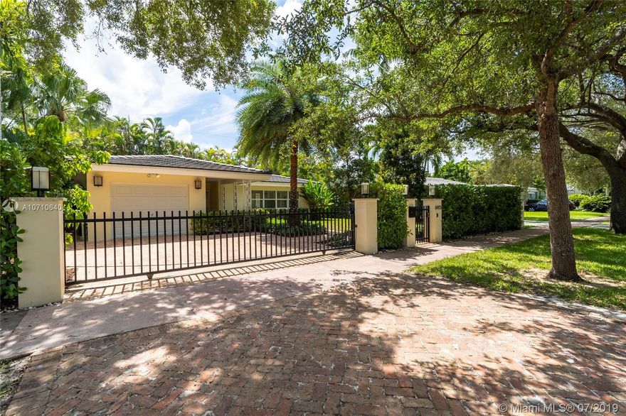 South Gables charmer gated and updated in Miami’s best location!!  Easy drive to Downtown, Gables or Grove, plus perfect location to South Miami shops & restaurants and Sunset Elementary. Sleek and modern in design with great curb appeal.  Updates include: 2015 Flat tile roof, impact windows and doors, new septic system, Updated kitchen and bathrooms with quartz counters, marble floors, Chicago Brick driveway/ walkway.  Don’t let this one get away!!!