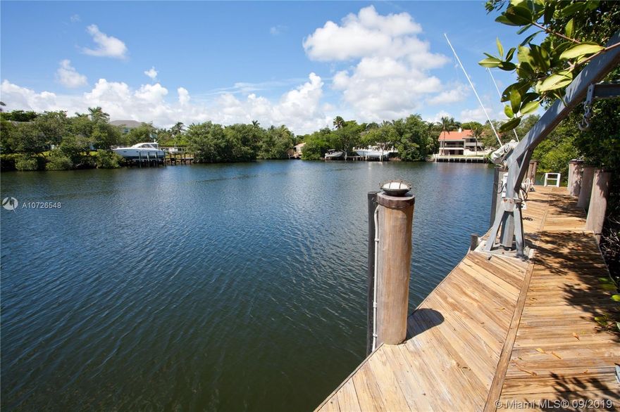 Sophisticated modern home in sought after Islands of Cocoplum w/97 ft waterfront & access to the bay. The double height ceilings in foyer and living rm, along with the skylight, provide extra light to this home. The eat-in kitchen w/top-of-the-line appliances, features a large island and opens to the family rm, w/views of covered terrace, pool & waterway. Guest bedrm, maid's quarters & laundry on 1st flr. On 2nd flr, the luxurious master suite consists of a very spacious bathrm, great walk-in closet & den/nursery. Off the master bedrm, there is a huge terrace w/a staircase to salt-water heated pool & deck. 2+bedrms w/private bathrms & walk-in closets on 2nd flr. 3-car garage, impact windows/doors & large driveway. Islands of Cocoplum features: clubhouse, gym, tennis courts, pool & more.